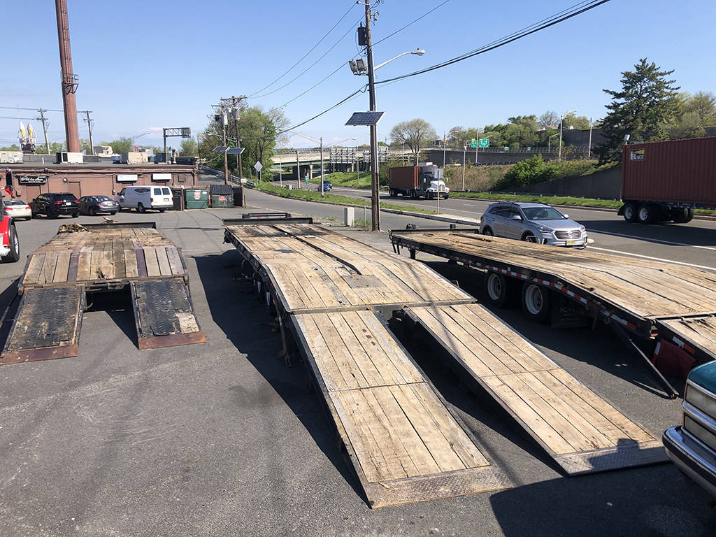 Flatbed Trailers we use to transport our paving equipment